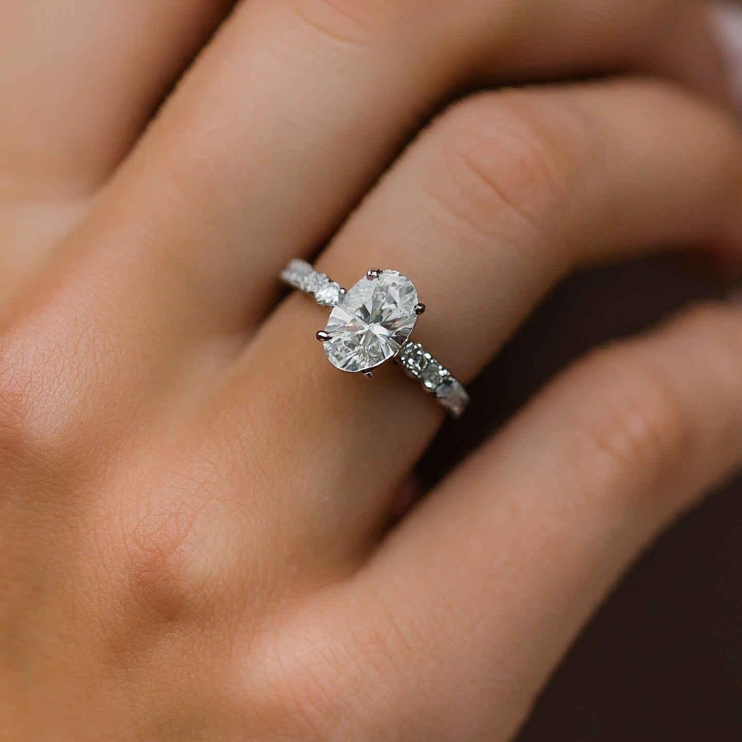 4 Prong Oval Cut Side Stone Diamond Ring