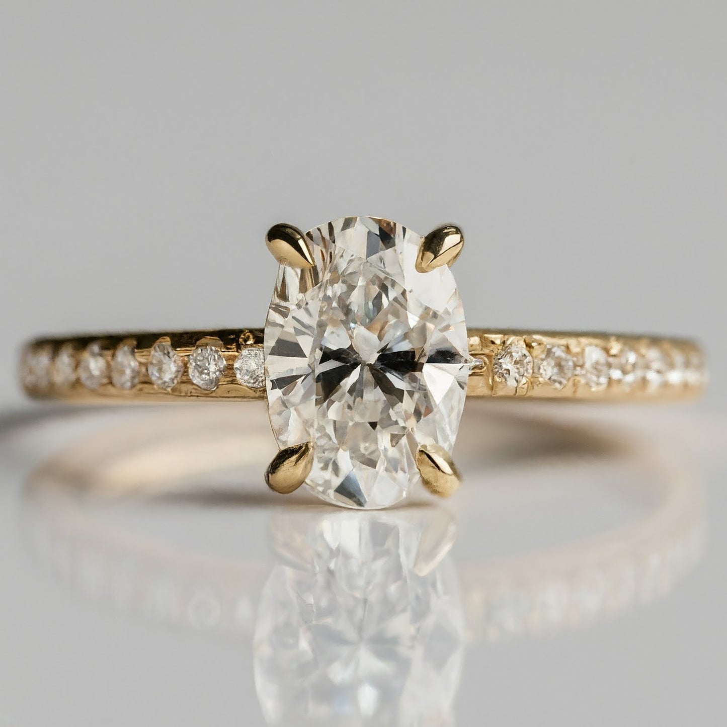 4 Prong Oval Cut Side Stone Diamond Ring