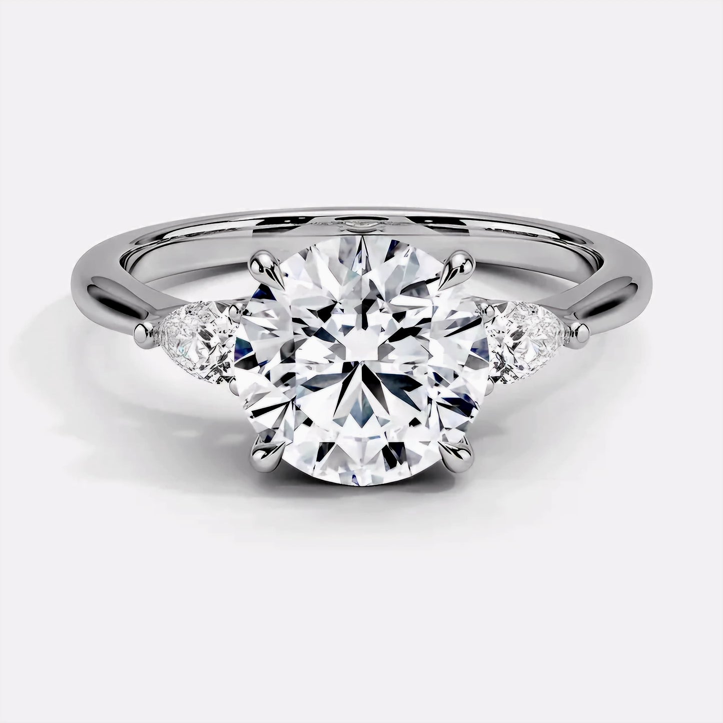 Round and Pear Trilogy Diamond Ring