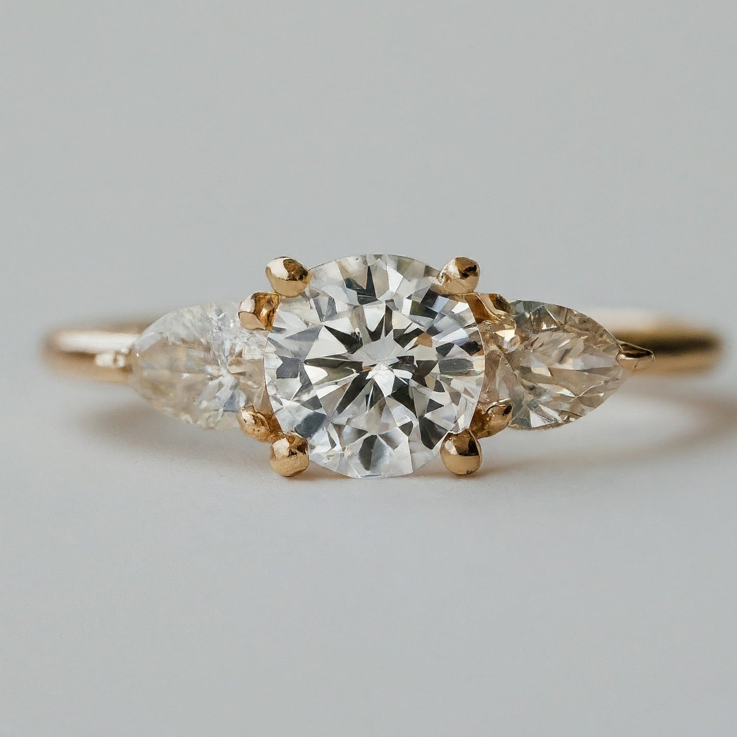 Round and Pear Trilogy Diamond Ring