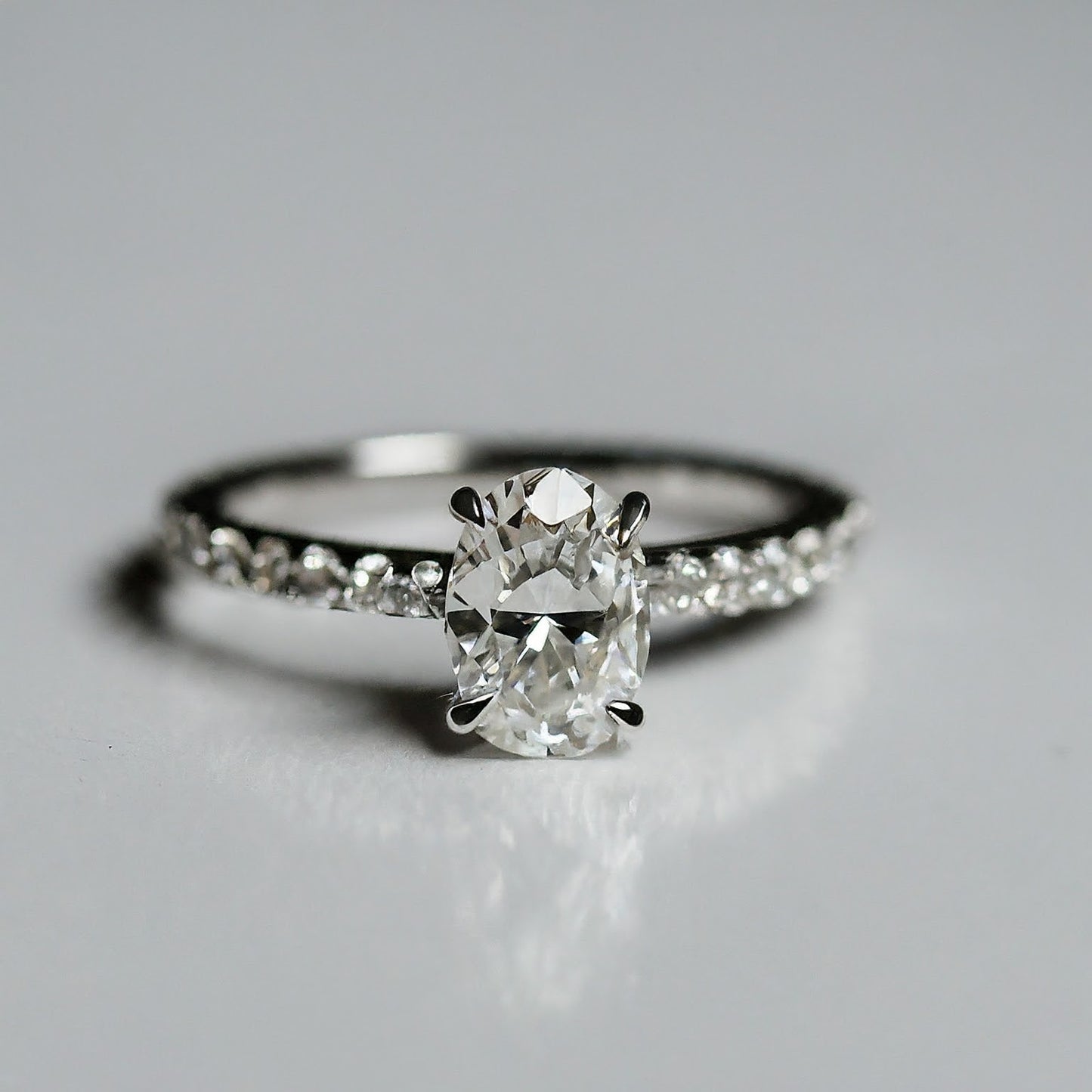 4 Prong Oval Cut Side Stone Diamond Ring